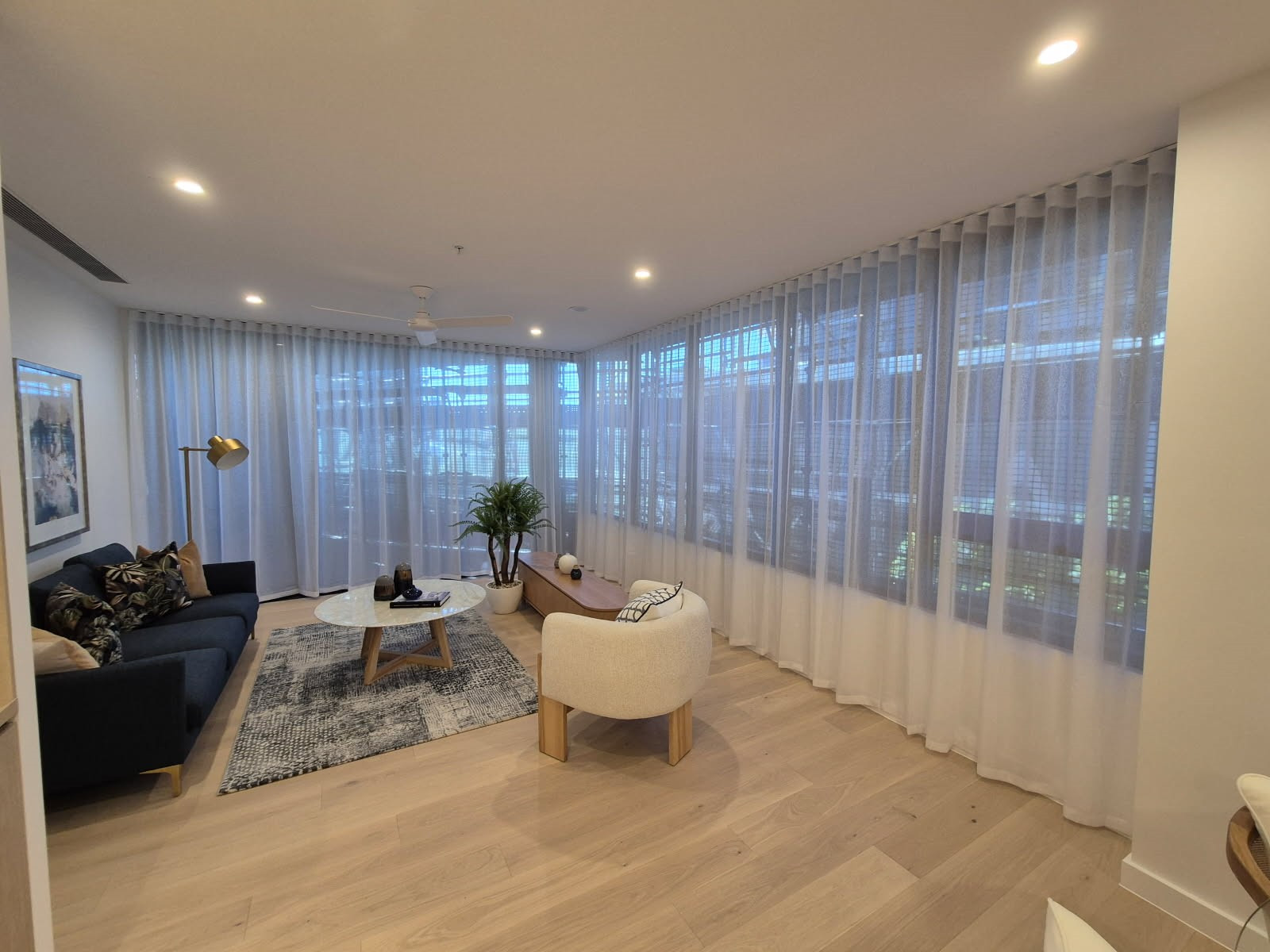 Custom-made sheer curtains in an apartment at The Lanes