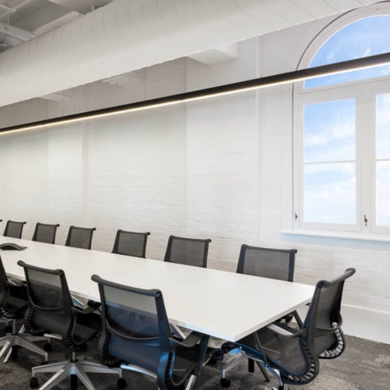 Commercial roller blinds fitted to large glazed office windows