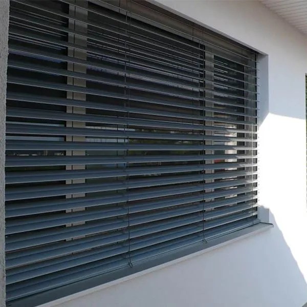 External venetian blinds shading a resort facade