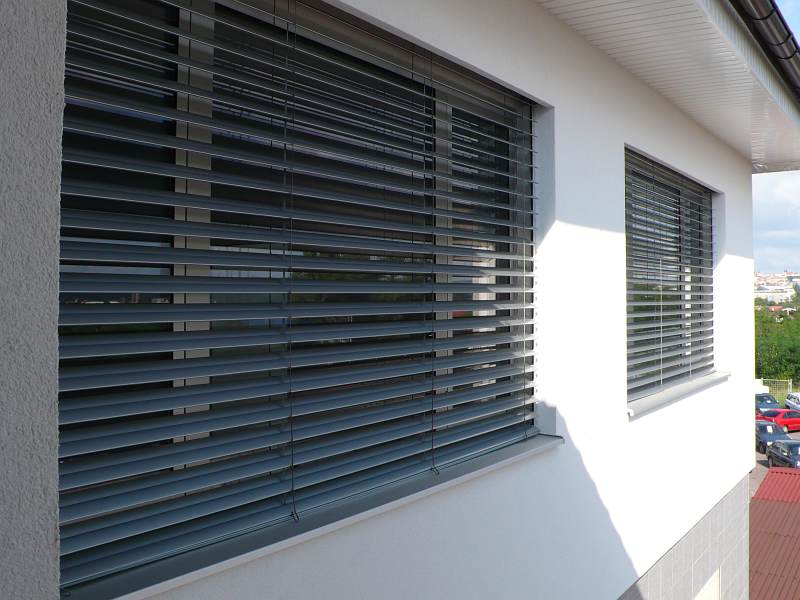 External venetian blinds shading a campus building facade